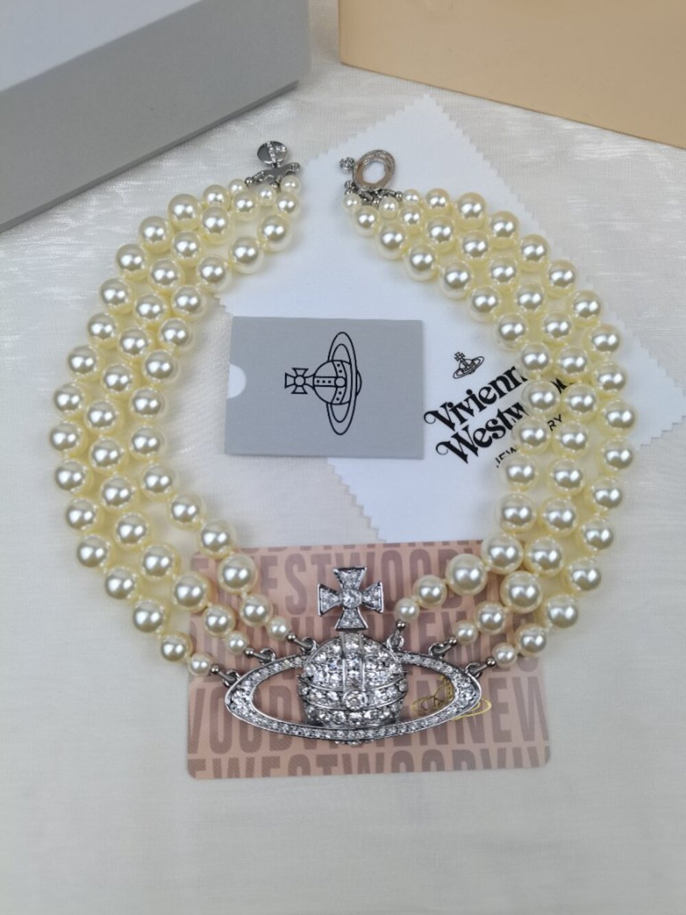 Vivienne Westwood Three Row Pearl Bas Relief Choker in Silver